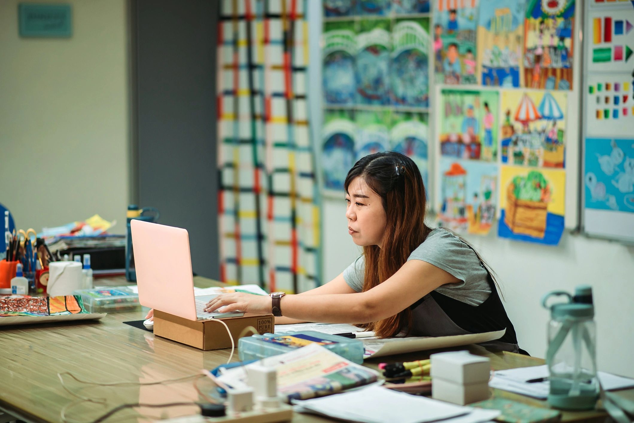 Professional woman teaching and speaking through a laptop